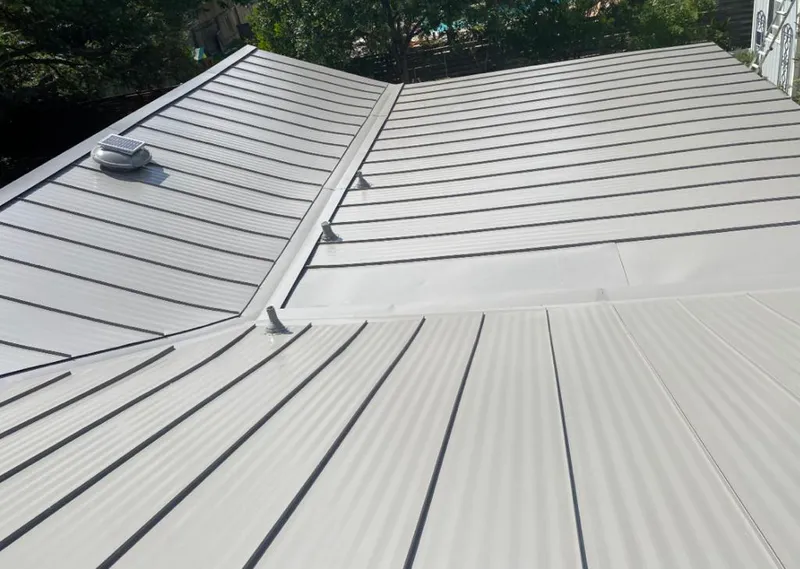 Solar attic fan installed on a metal roof for Roof Ventilation in Northumberland